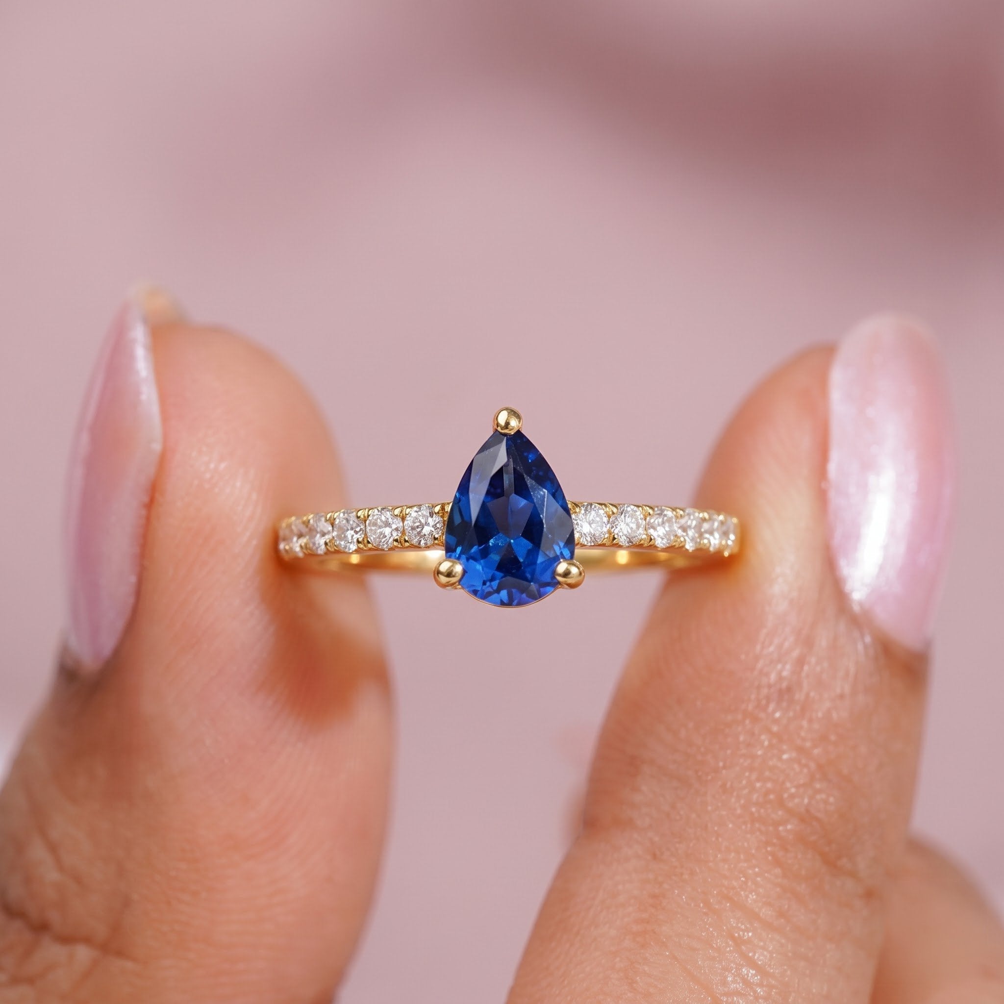 Pear Cut Blue Sapphire Ring with Pavé Band