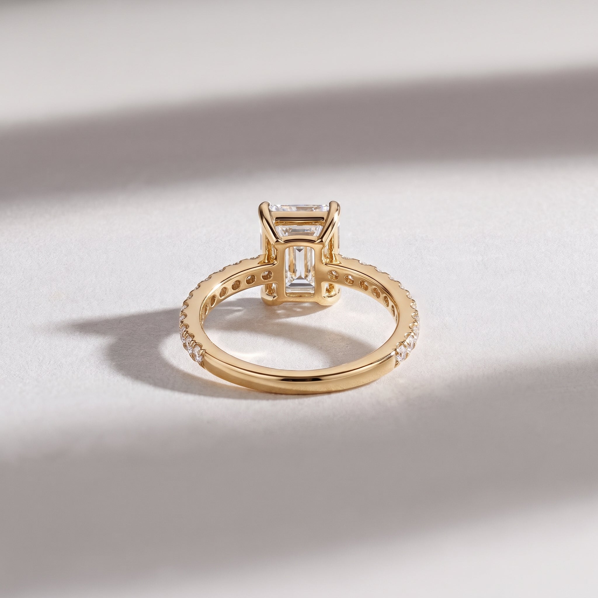 Emerald Cut Diamond Solitaire Ring with Pavé Band