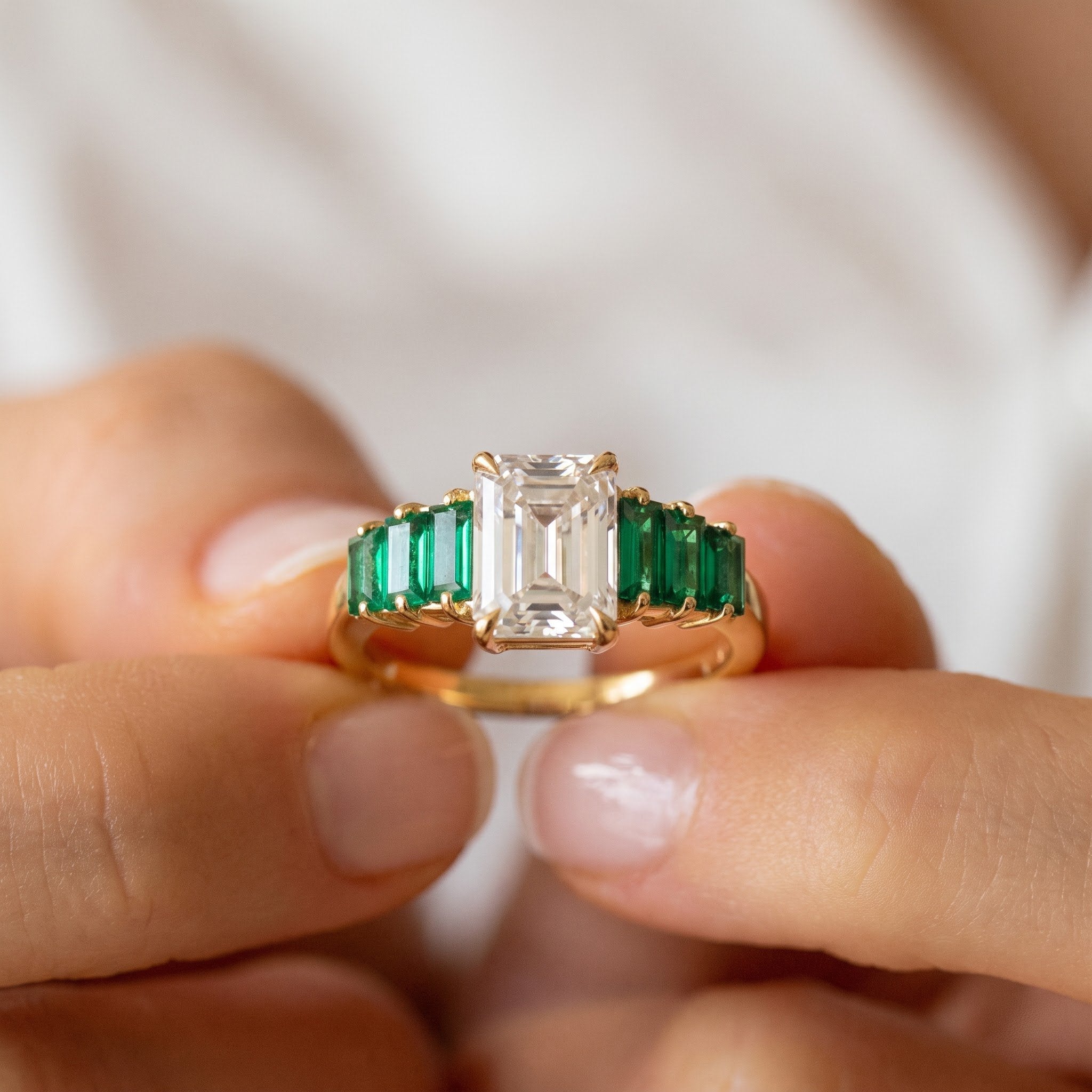 Radiant Cut Diamond Ring with Side-Stone Emerald Baguettes