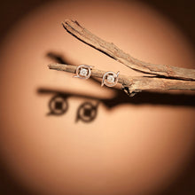 Solitaire Whirlwind Stud Earrings